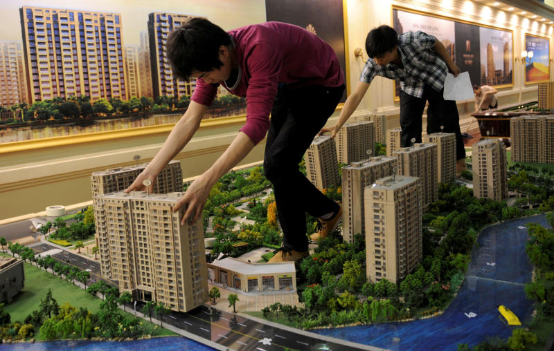 Major Chinese city scraps housing curbs as easing gains pace
