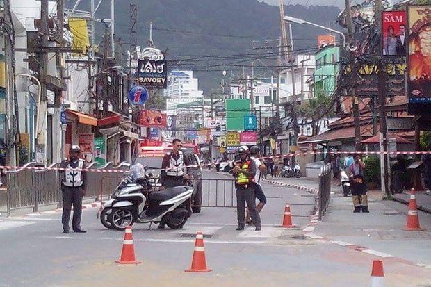 Security officials barricade one of the areas in Phuket after three bombings on the resort island since 8am on Friday. (Photo by Achadtaya Chuenniran)