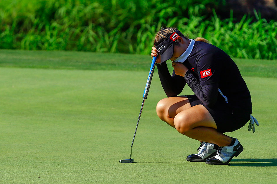 Ariya Jutanugarn reacts after missing her par putt on the 17th green during the final round of the US Women's Open golf tournament at Shoal Creek in Birmingham, Alabama.